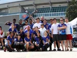 Students in Dragon Boat Team jerseys posing for a group photo