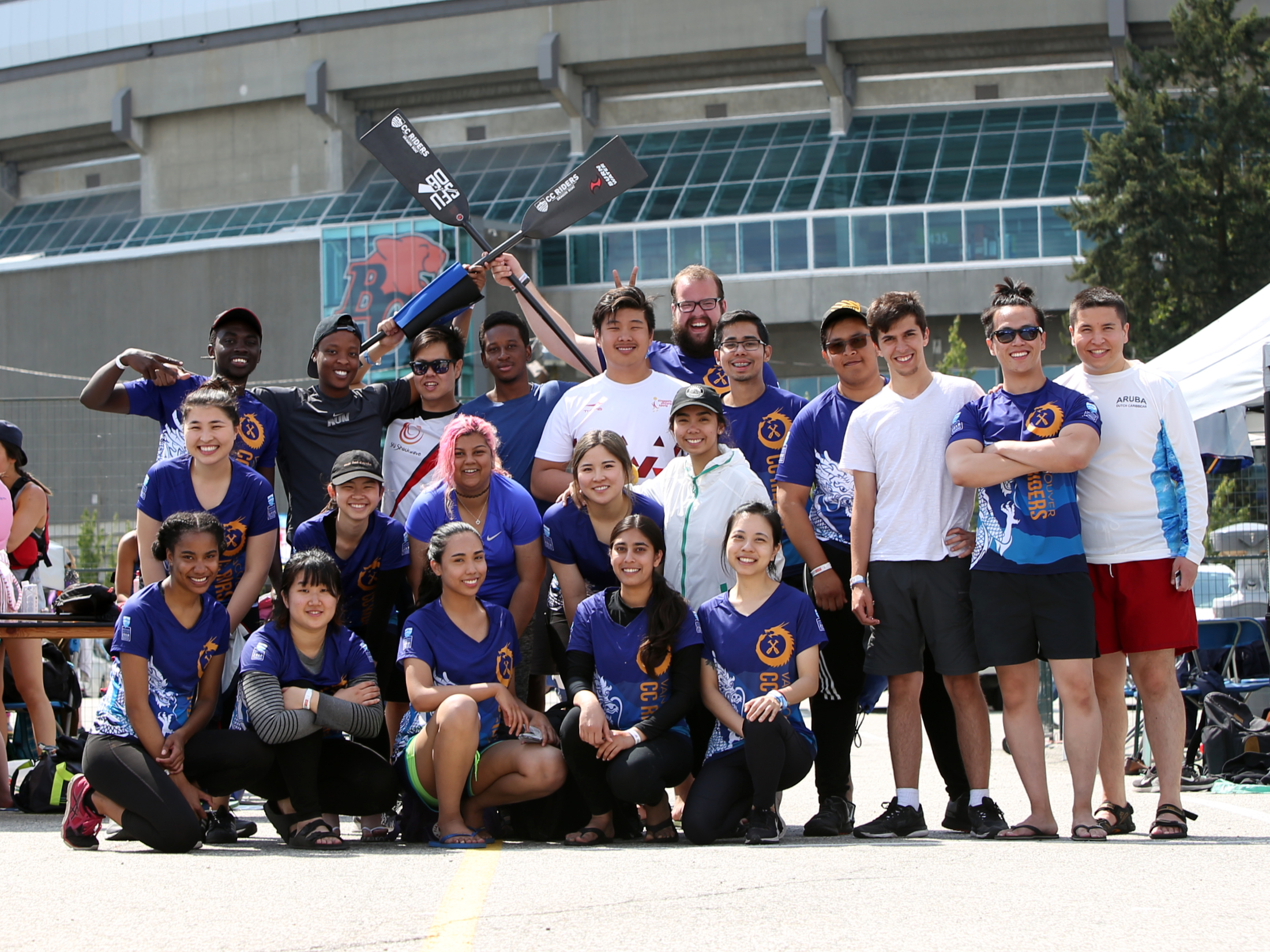 Students in Dragon Boat Team jerseys posing for a group photo