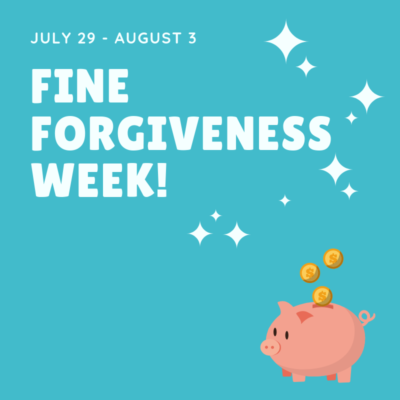 White text on a blue background that says "July 29 - August 3 Fine Forgiveness Week!" with an image of a piggy bank that has gold coins falling into it.